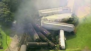 In this aerial image made from a video provided by WPXI, smoke rises in the air after dozens of cars of a freight train carrying hazardous materials derailed in Hyndman, Pa., Wednesday, Aug. 2, 2017. County officials ordered all residents of the small Pennsylvania town to evacuate after the derailment. (WPXI via AP)
